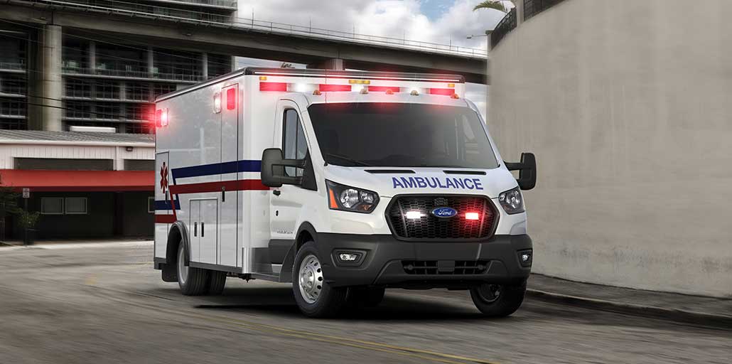 A 2020 Ford Transit ambulance rushing to an emergency.