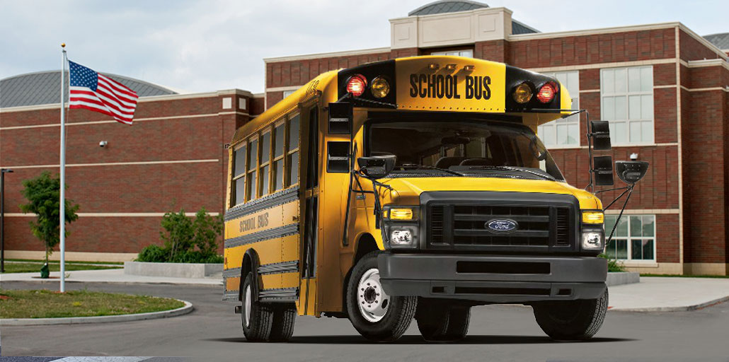 Ford school bus transporting students.